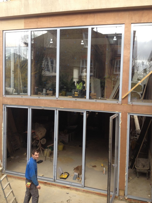 Aluminium bi-fold doors with two-storey glazing in Walworth